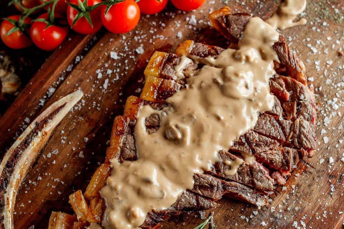 Fried meat slice with mushroom cream