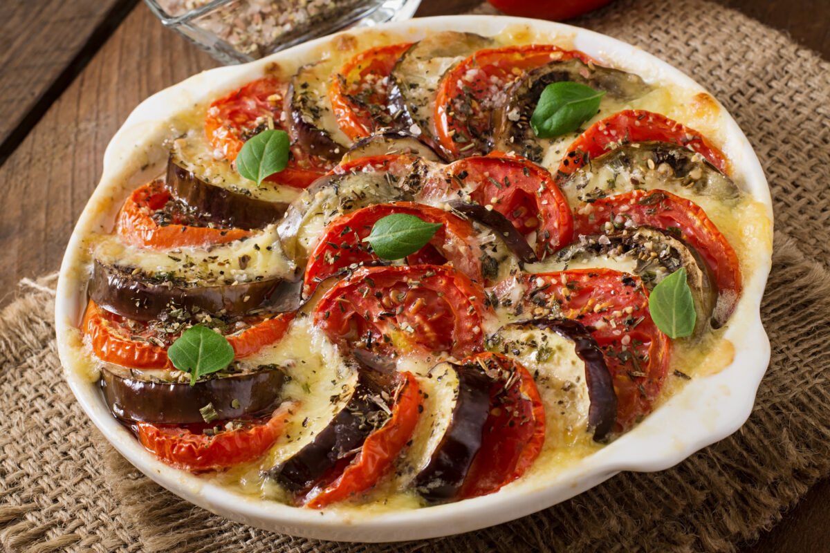 Prepared gratin dish raw eggplant with mozzarella and tomatoes