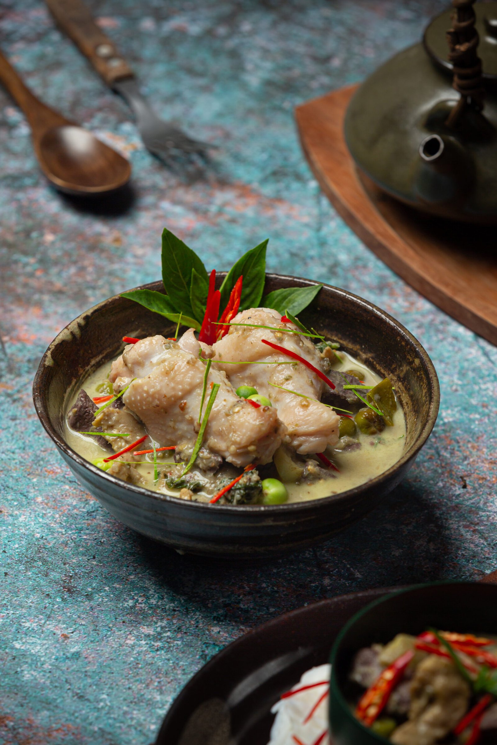 Rice noodles, chicken green curry, coconut milk thai food.