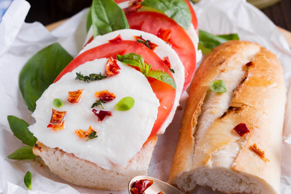 Tasty baguette with mozzarella plate