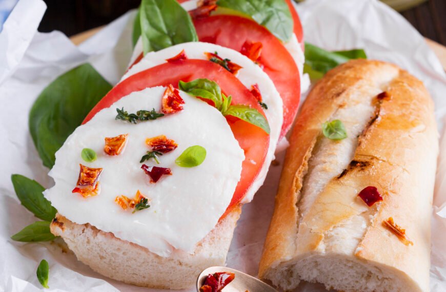 Tasty baguette with mozzarella plate
