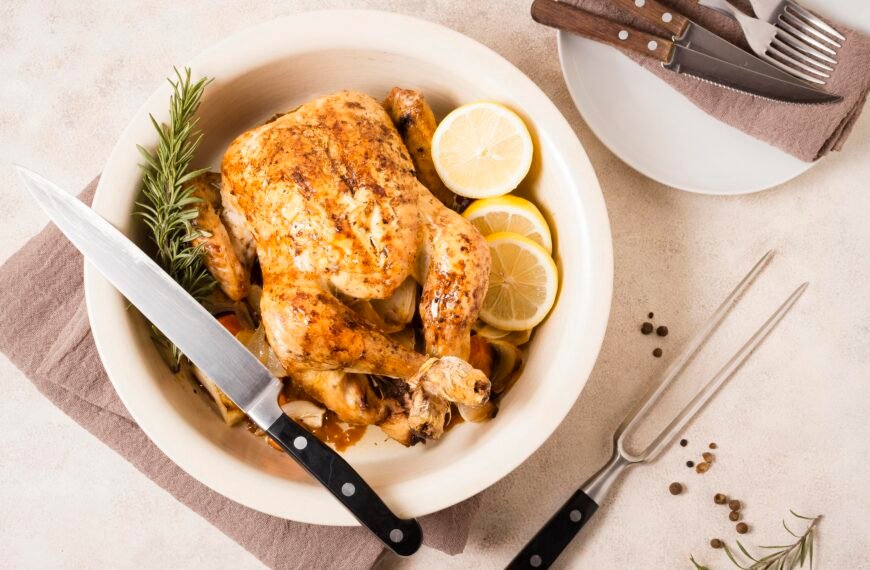 Top view thanksgiving roasted chicken dish with lemon slices